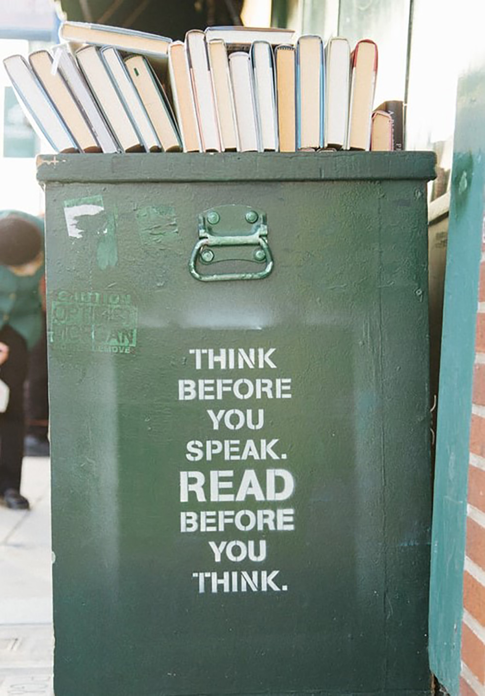 Graffiti that reads 'think before you speak. read before you think.'